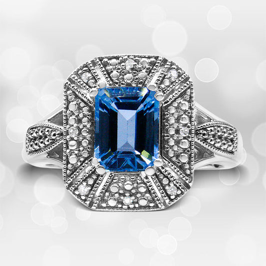 .925 Sterling Silver Diamond Accent and 8X6 mm Emerald-Shape Blue Topaz Ring (I-J Color, I2-I3 Clarity) - Ring Size 7 — photo 1 of 10