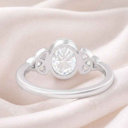 The Celtic Embrace: 1.2ct Oval Moissanite Bezel Ring