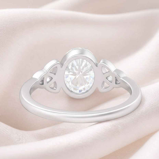 The Celtic Embrace: 1.2ct Oval Moissanite Bezel Ring