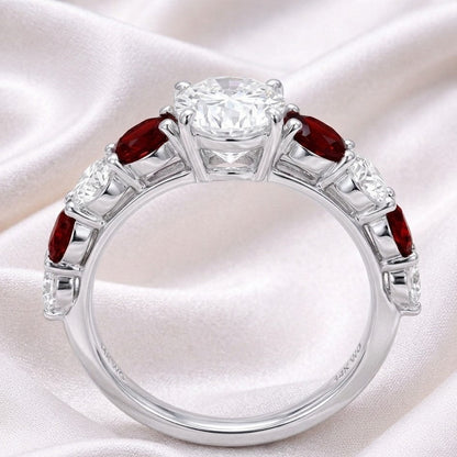 The Crimson Melody: 2.87ct Oval Moissanite & Red Accent Engagement Ring