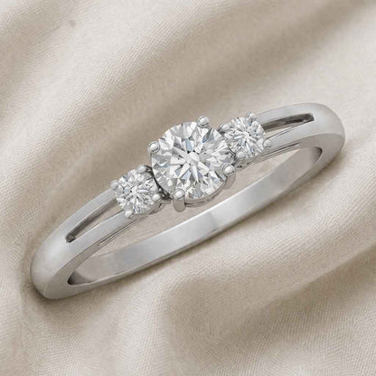 The Triad Glow: 0.7ct Round Moissanite Three-Stone Ring