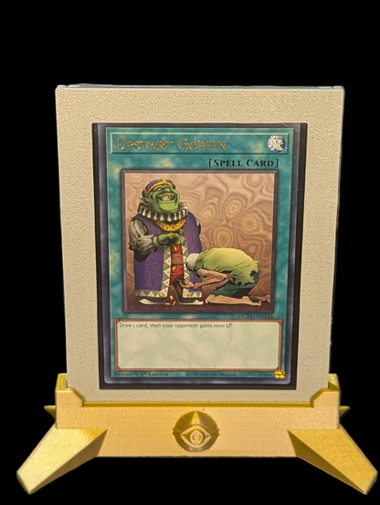 Upstart Goblin card on a display stand with a white background